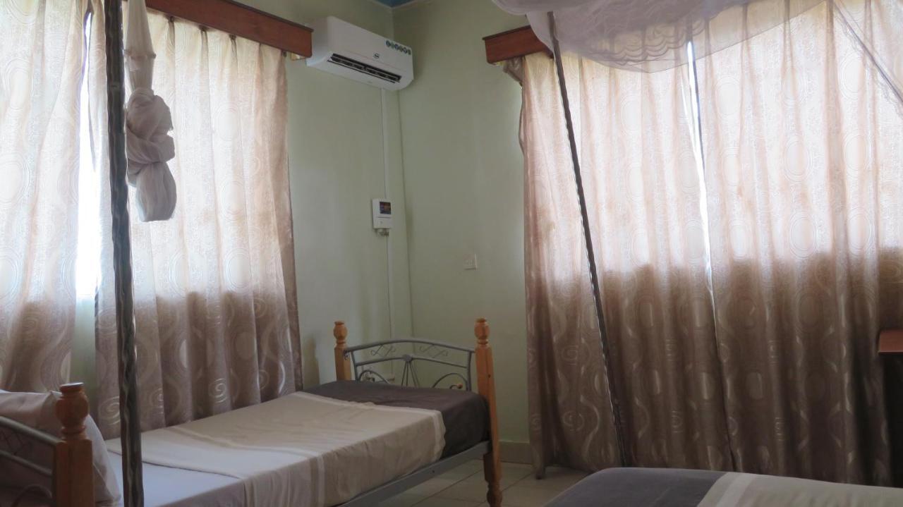 Global Village Hotel Pakwach Bagian luar foto