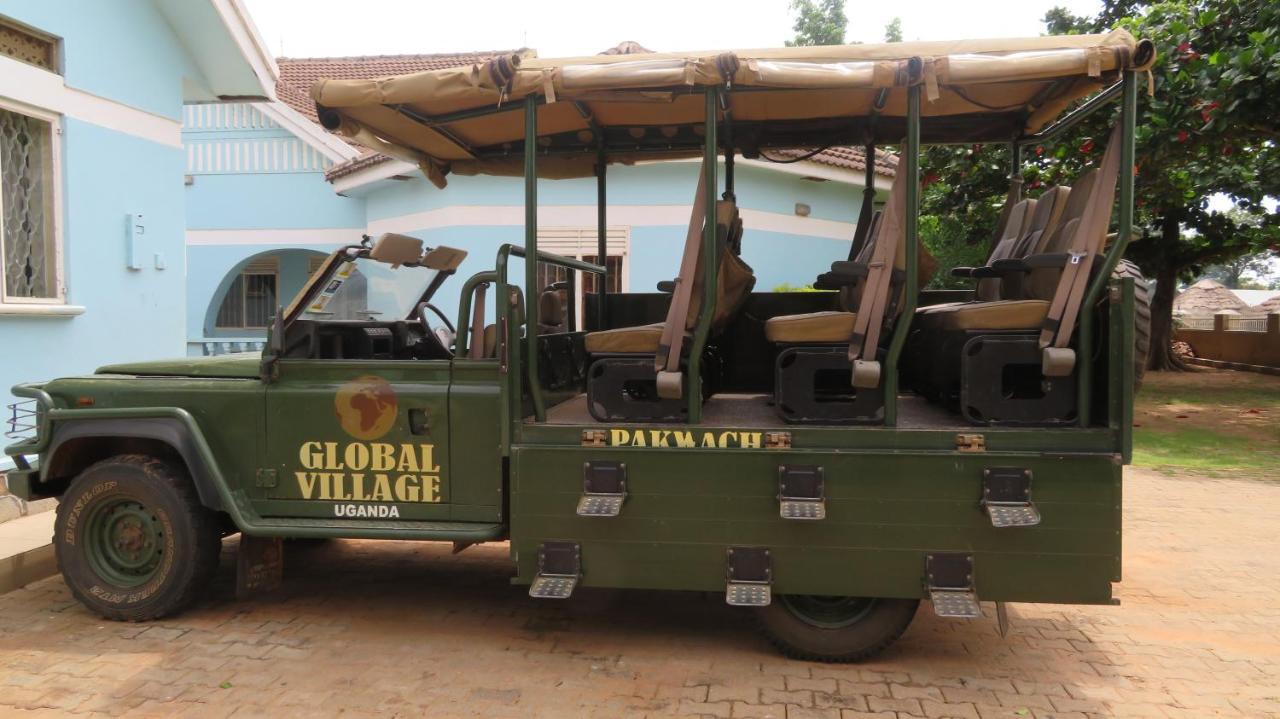 Global Village Hotel Pakwach Bagian luar foto