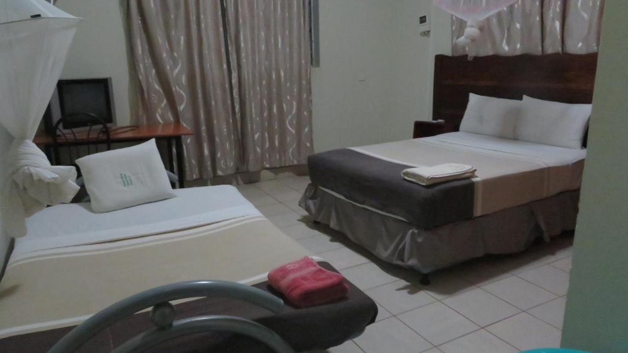 Global Village Hotel Pakwach Bagian luar foto